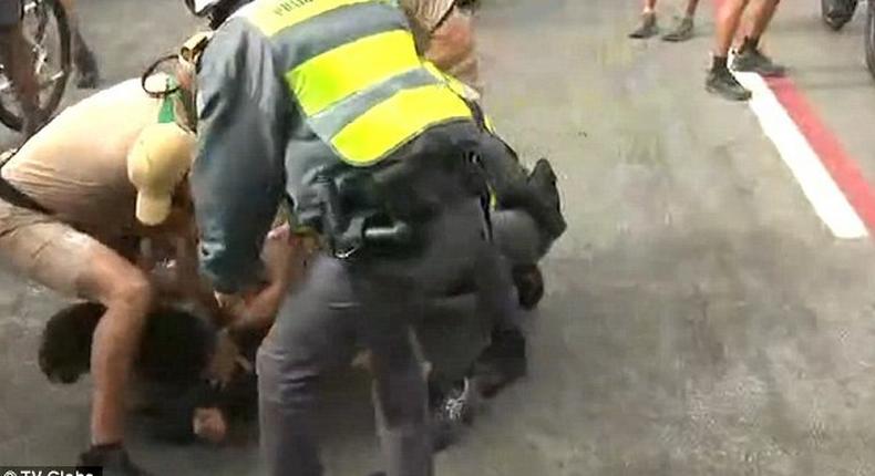 Man who tried to steal Olympic torch is seen being restrained