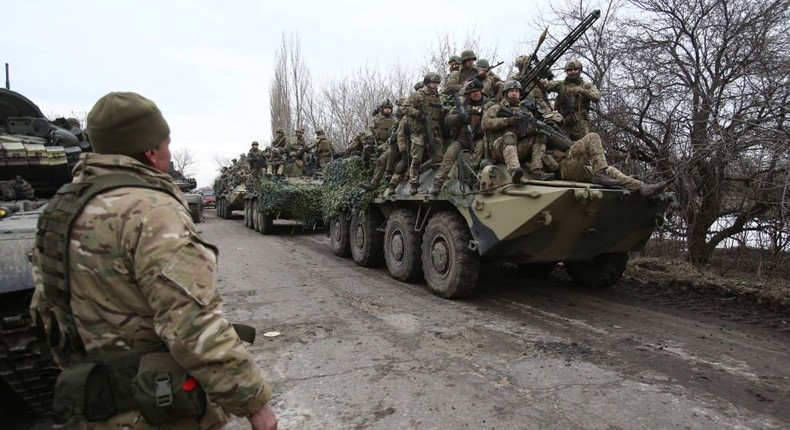 Ukrainian servicemen get ready to repel an attack in Ukraine's Lugansk region on February 24, 2022. (Photo by ANATOLII STEPANOV/AFP via Getty Images)