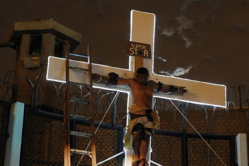 An inmate depicting Jesus performs the crucifixion scene in the theatre play Jesus Christ Superstar