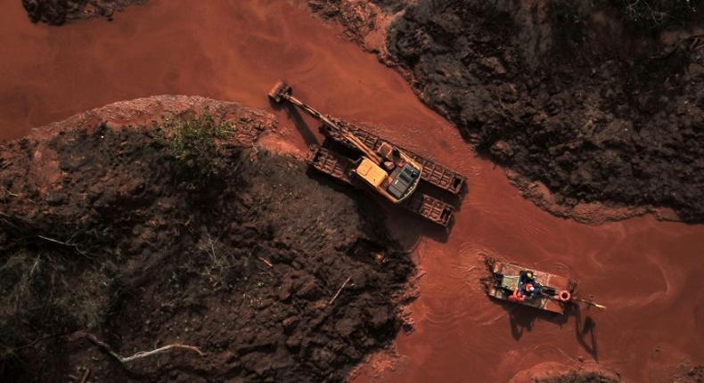 Emergency crews use an amphibious vehicle and heavy machinery in May 2019 to pick through mud and search for bodies, 99 days after the collapse of the Corrego do Feijao Dam in Minas Gerais