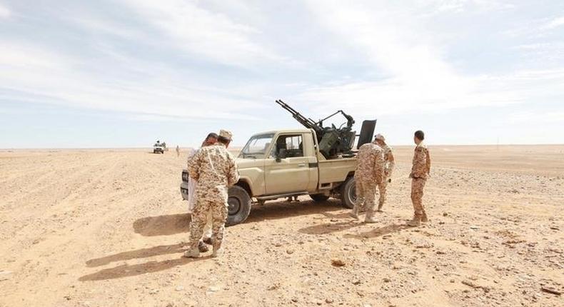 Libyan soldiers stand at a military outpost in Wadi Bey, west of the Islamic State-held city of Sirte, February 23, 2016 REUTERS/Ismail Zitouny