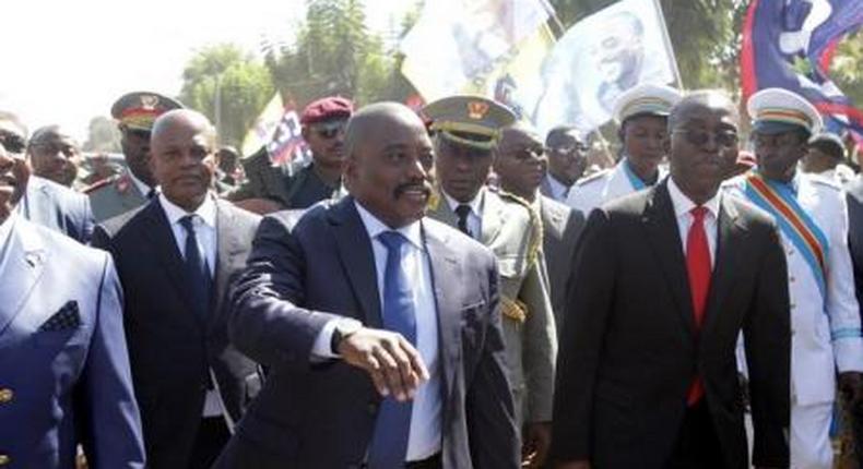 Democratic Republic of the Congos President Joseph Kabila (C) greets supporters as he arrives at the airport in Lubumbashi, the capital of Katanga province in the Democratic Republic of Congo, June 13, 2016.