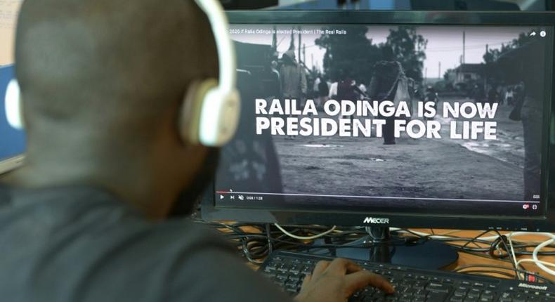 A man watches a hard-hitting online campaign ad just weeks before national elections, in Nairobi on July 13, 2017