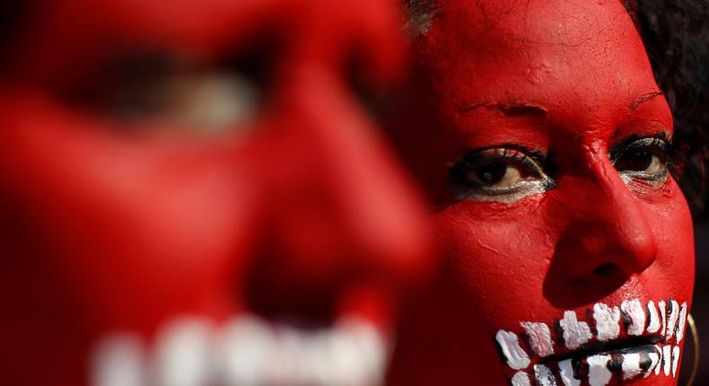 Women with their faces painted march to mark the 29-month anniversary of the disappearance of 43 students of the Ayotzinapa school in Guerrero, in Mexico City, February 26, 2017.