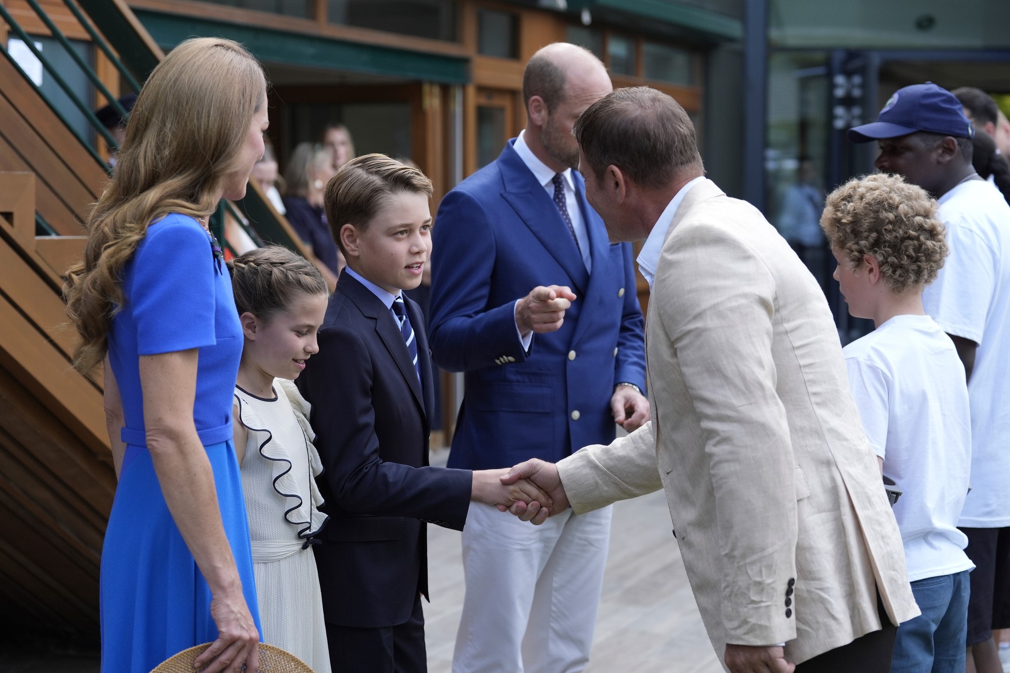 Britský princ William, princezná z Walesu Kate, princ George a princezná Charlotte prichádzajú na tenisový šampionát vo Wimbledone v Londýne.