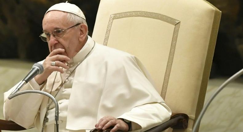 Pope Francis looks on during a general audience at the Paul VI Audience Hall at the Vatican on February 8, 2017