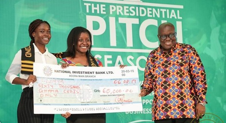 Matilda Asantewaa Sampong and Emilee Otoo Quayson receive cheque from President Akufo-Addo