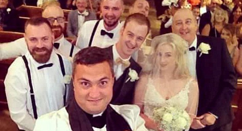 Vicar Paul Frost interrupted the ceremony of bride Emma Scarborough and groom Jamie to take the photograph using a selfie stick and is believed to be the first vicar to perform the stunt