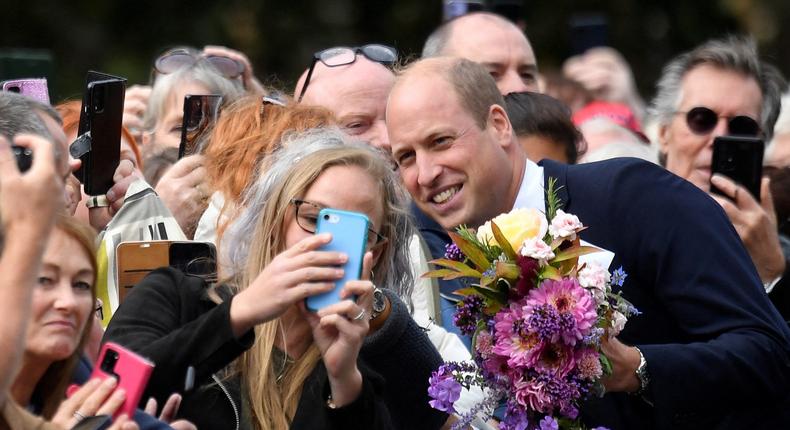 Prince William took a selfie with a member of the public outside the royal family's Sandringham Estate on September 15 following the death of Queen Elizabeth II.TOBY MELVILLE/POOL/AFP via Getty Images