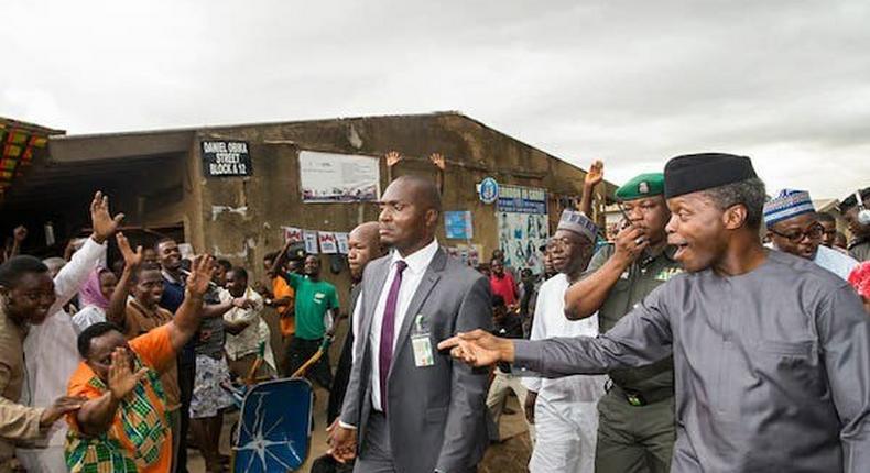 Osinbajo interacts with traders at Garki Market