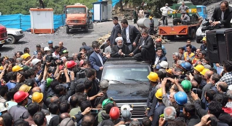 Iranian President Hassan Rouhani visits the coal mine in Azadshahr where an explosion trapped and killed dozens of workers