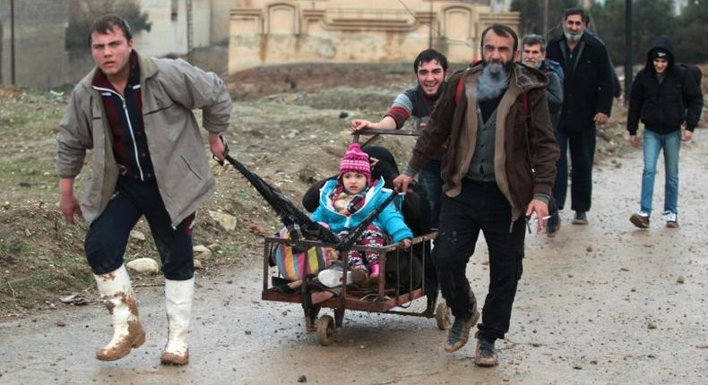 Iraqi families flee an area near Mosul controlled by Islamic State group on January 22, 2017