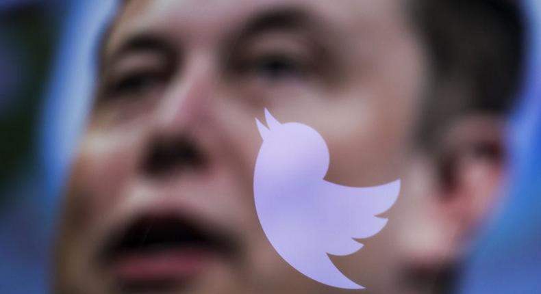 In this photo illustration, the image of Elon Musk is displayed on a computer screen and the logo of twitter is reflected in Ankara, Turkiye on October 06, 2022.Muhammed Selim Korkutata / Anadolu Agency via Getty