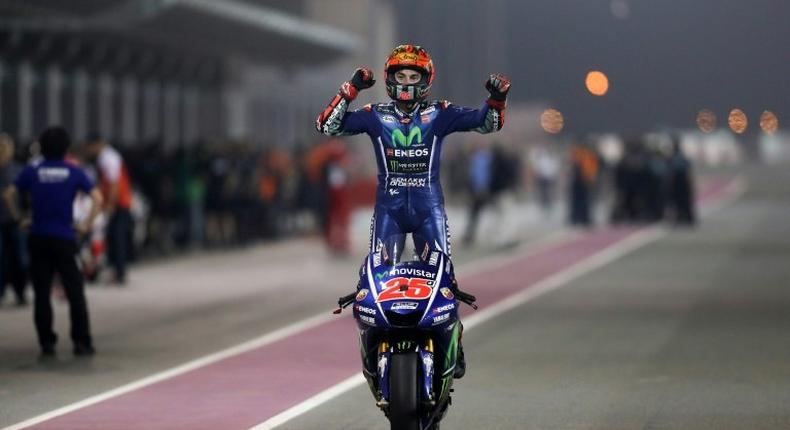 Movistar Yamaha MotoGP's Spanish rider Maverick Vinales celebrates after winning the 2017 Qatar MotoGP