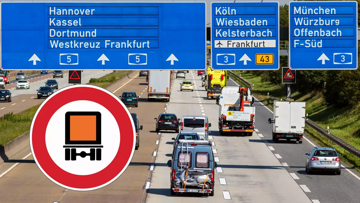 Znak z pomarańczową ciężarówką na niemieckich drogach