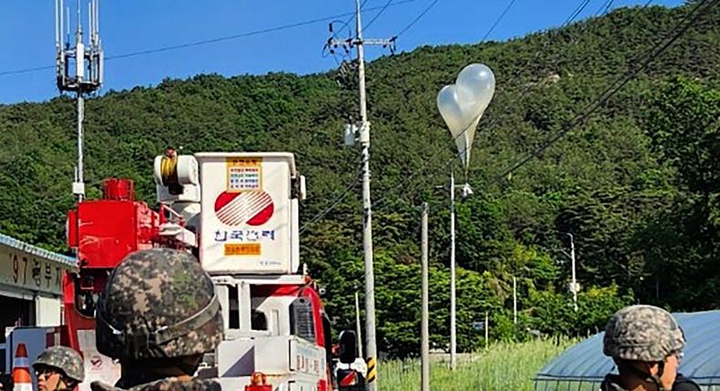 Balloons hang on utility poles.Jeonbuk Fire Headquarters via AP
