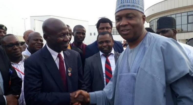 Senate President Bukola Saraki pumps fists with EFCC boss Ibrahim Magu. The senate has refused to confirm Magu as substantive EFCC Chairman