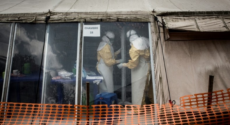 Health personnel work inside the 'red zone' of an Ebola treatment centre in Butembo, one of two attacked in recent months, hampering the fight to stem the disease's spread