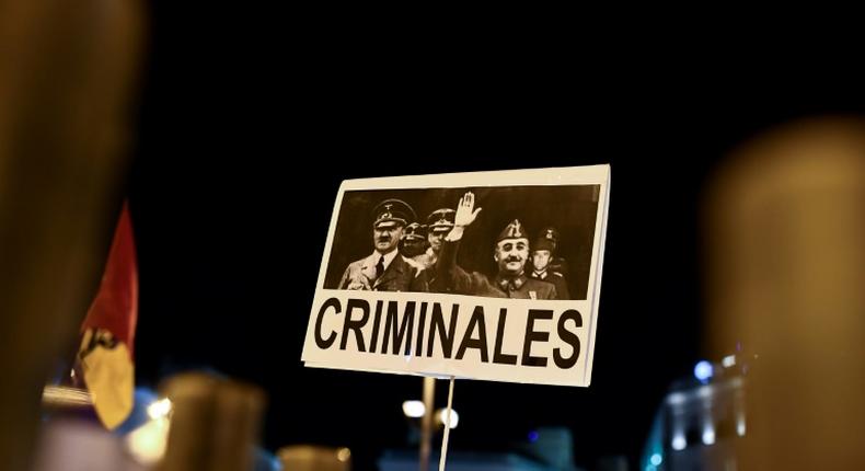 A placard depicting German leader of the Nazi party Adolf Hitler and Spanish dictator Francisco brandished in Madrid last year during a protest after Franco's remains were moved from a grandiose state mausoleum to  more discreet grave