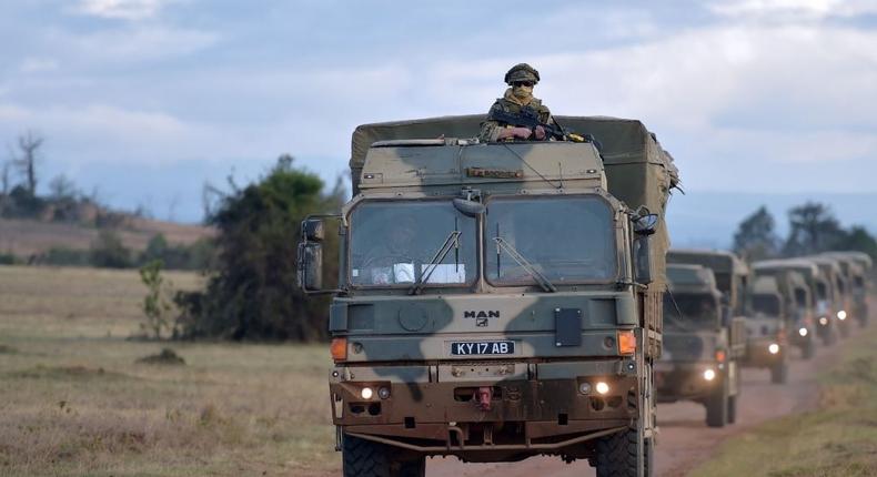 Military vehicles drive during a simulated military excercise of the British Army Training Unit in Kenya (BATUK) together with the Kenya Defence Forces (KDF) at the ol-Daiga ranch, high on Kenyas Laikipia plateau on March 26, 2018.  AFP PHOTO / TONY KARUMBA TONY KARUMBA/AFP via Getty Images