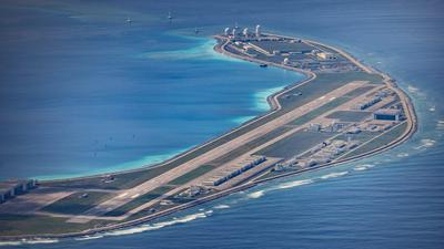 An airfield, buildings, and structures are seen on the artificial island built by China on Mischief Reef.Photo by Ezra Acayan/Getty Images