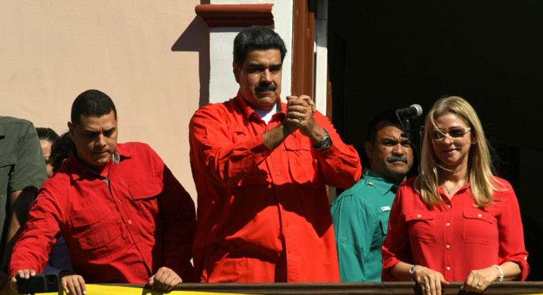 Venezuela President Nicolas Maduro (center) goads opposition leader Juan Guaido at an 'anti-imperialsim' rally in the capital Caracas