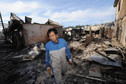 Mieszkaniec wyspy Yeonpyeong zniszczonej prze Koreę Płn., fot. Reuters