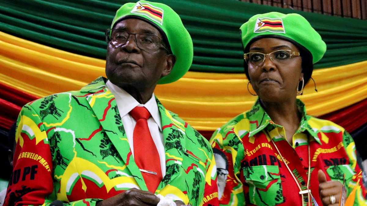 FILE PHOTO: Zimbabwean President Robert Mugabe and his wife Grace attend a meeting of his ruling ZAN