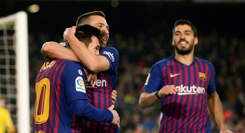 Lionel Messi celebrates with Jordi Alba after scoring on Sunday