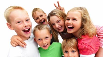 Group of excited young children laughing 