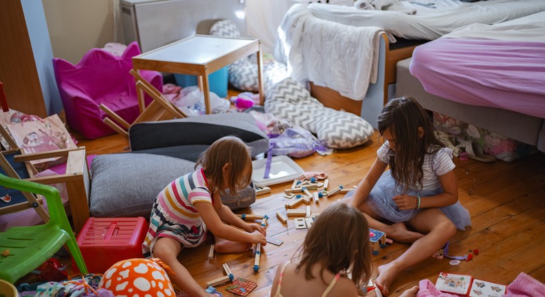 The author (not pictured) says that letting kids set the tone makes it easier to declutter.Viktor Cvetkovic/Getty Images