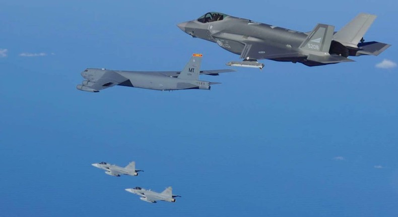 Swedish JAS 39 Gripens with a Norwegian F-35 and a US B-52 over Andya in northern Norway, August 18, 2022.