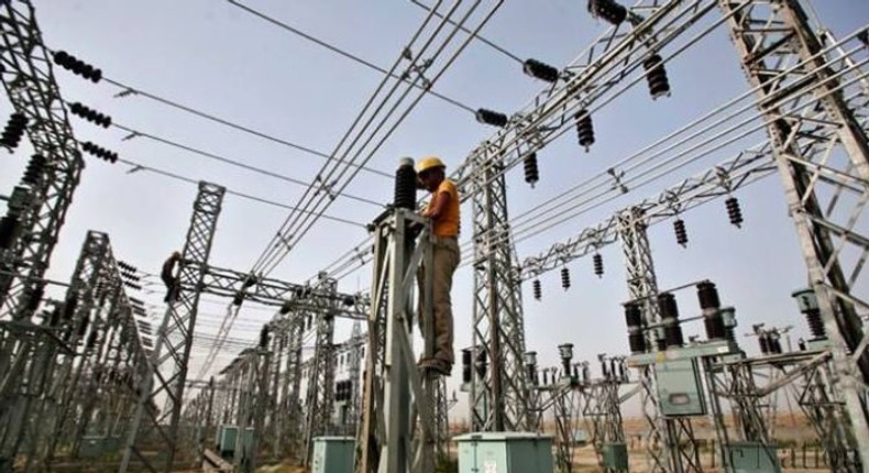 A man working on electricity cables in Nigeria   [thewillnigeria]