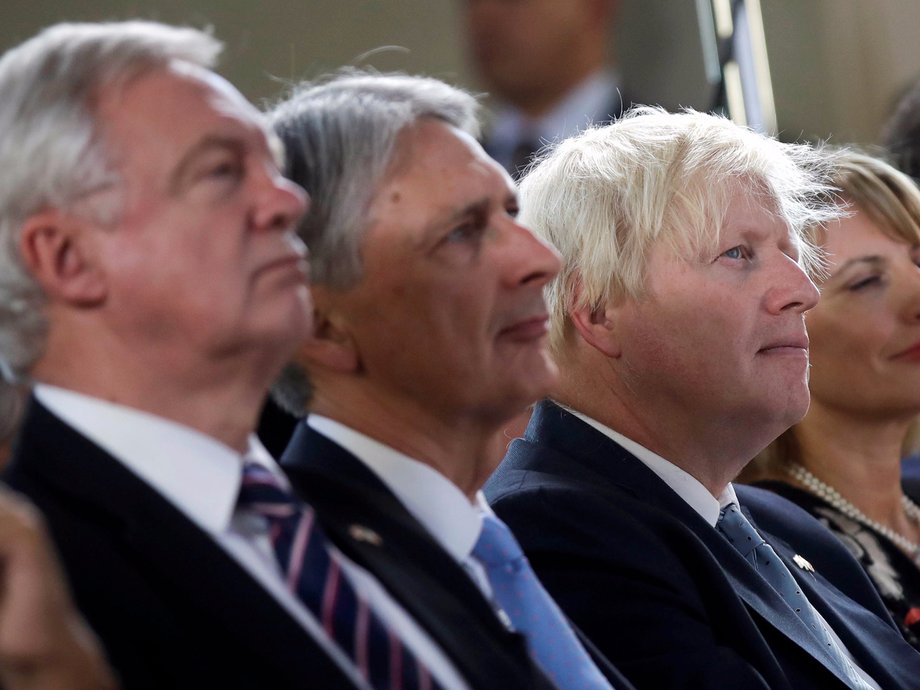 Chancellor Philip Hammond (C) with Foreign Secretary Boris Johnson (R) and Brexit Secretary David Davis