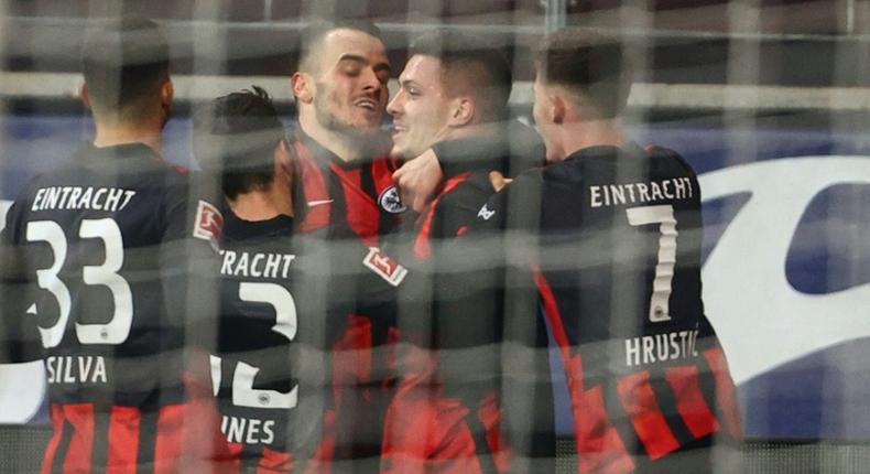 Luka Jovic (2R) celebrates after scoring Eintracht Frankfurt's winning goal on Sunday