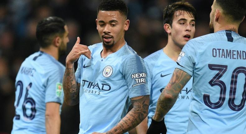Cloud nine: Gabriel Jesus (2nd left) scored four of Manchester City's goals in a 9-0 thrashing of Burton Albion on Wednesday