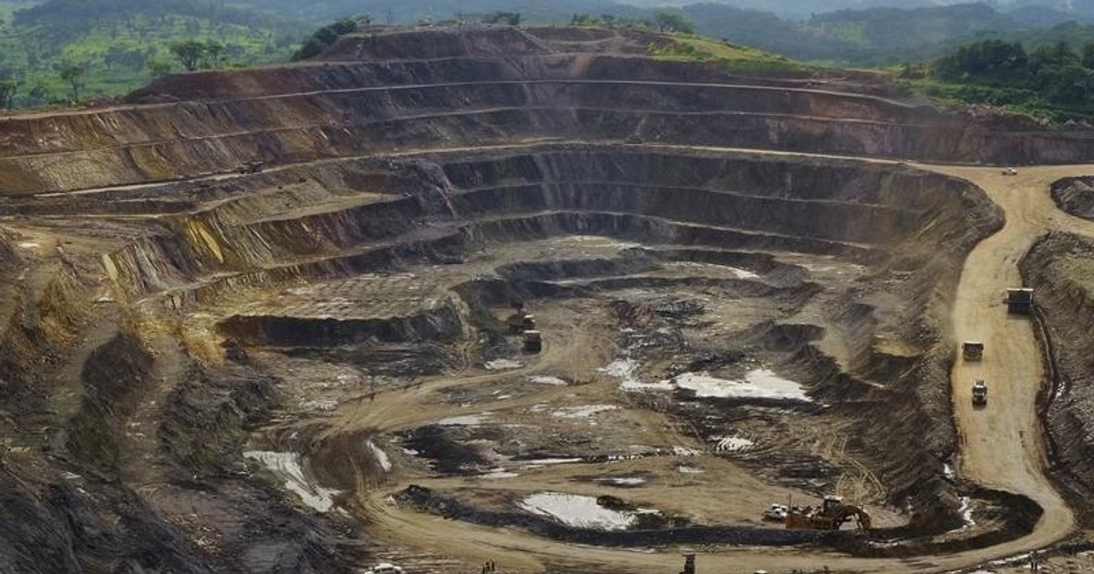 Excavators and drillers at work in an open pit at Tenke Fungurume, a copper and cobalt mine 110 km (68 miles) northwest of