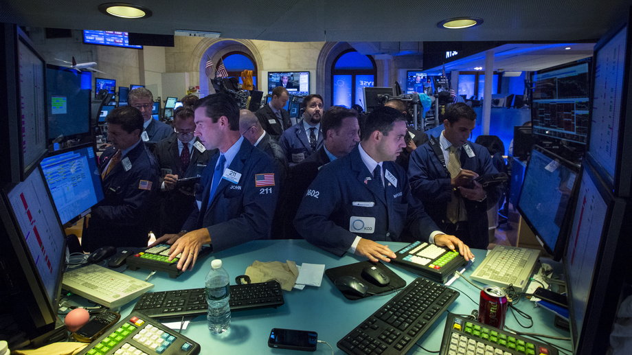Traders work on the floor of the New York Stock Exchange on August 24, 2015.