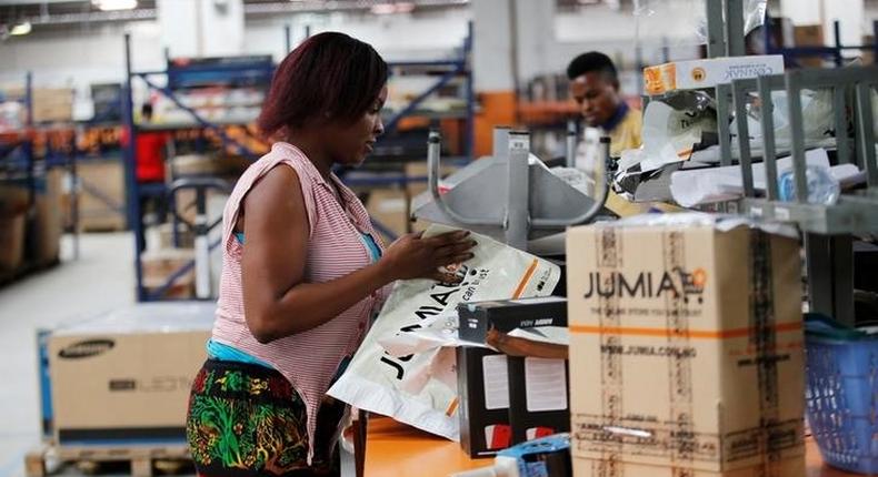 A woman works at the packaging unit at a warehouse for an online store, Jumia in Ikeja district, in Nigeria's commercial capital Lagos June 10, 2016.
