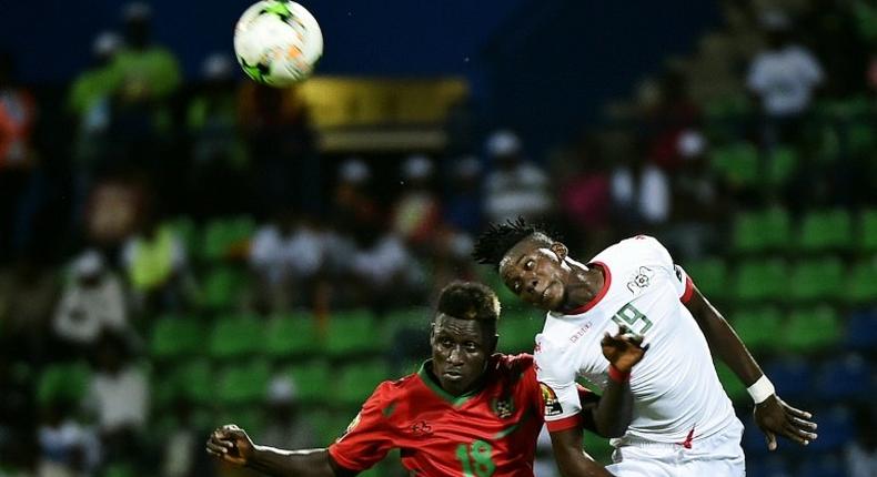 Burkina Faso's forward Bertrand Traore (R) challenges Guinea-Bissau's forward Piqueti during the 2017 Africa Cup of Nations group A football match between Guinea-Bissau and Burkina Faso in Franceville on January 22, 2017