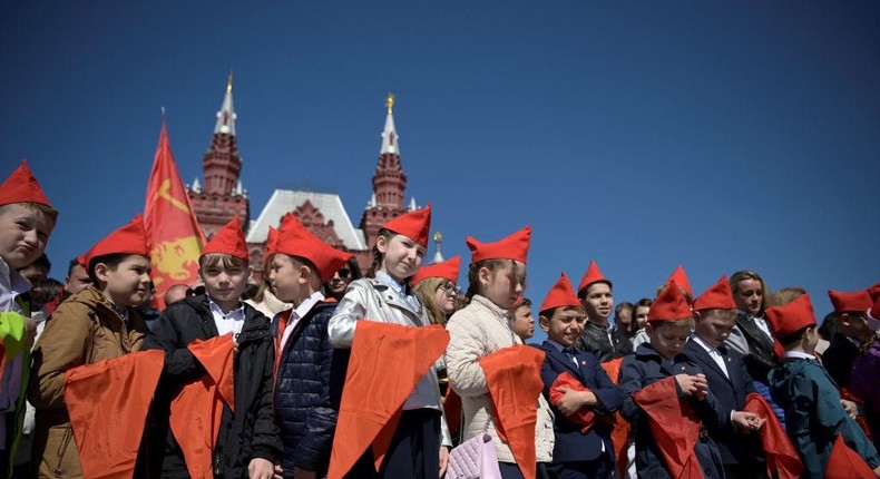 Children attend an official initiation ceremony for a youth organization in Moscow's Red Square.NATALIA KOLESNIKOVA/Getty Images