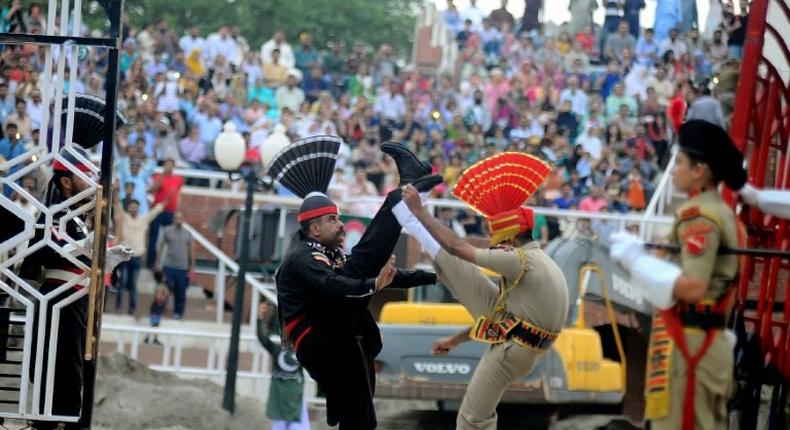 Indian and Pakistani border guards take part in the ceremony at the India-Pakistan border in Wagah