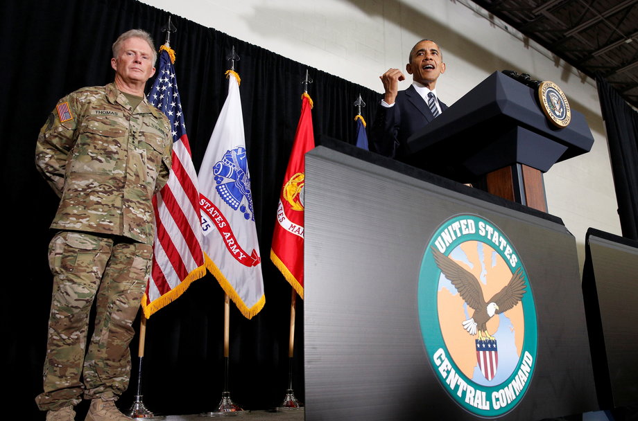 General Raymond Thomas (L) stands by as U.S. President Barack Obama speaks to active service members and their families during his visit to MacDill Air Force Base, home to U.S. Central Command and U.S. Special Operations Command, in Tampa, Florida, U.S. December 6, 2016.