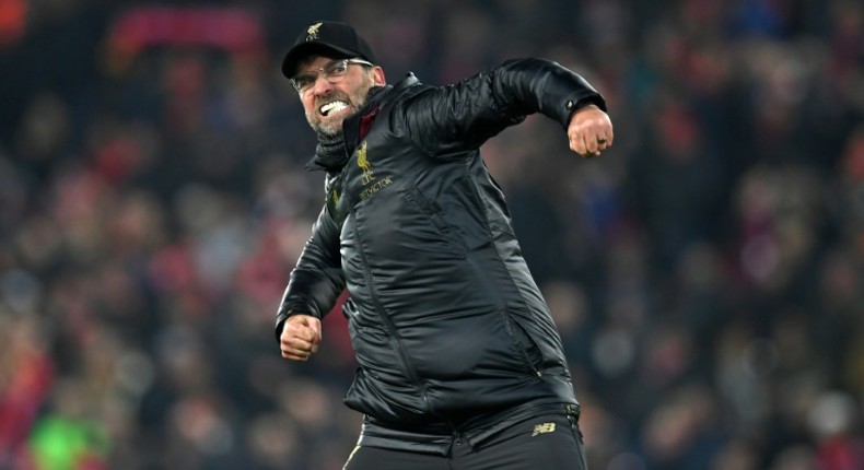 Jurgen Klopp celebrates after a dramatic 4-3 win over Crystal Palace at Anfield on Saturday extended his Liverpool side's lead at the top of the Premier League table to seven points