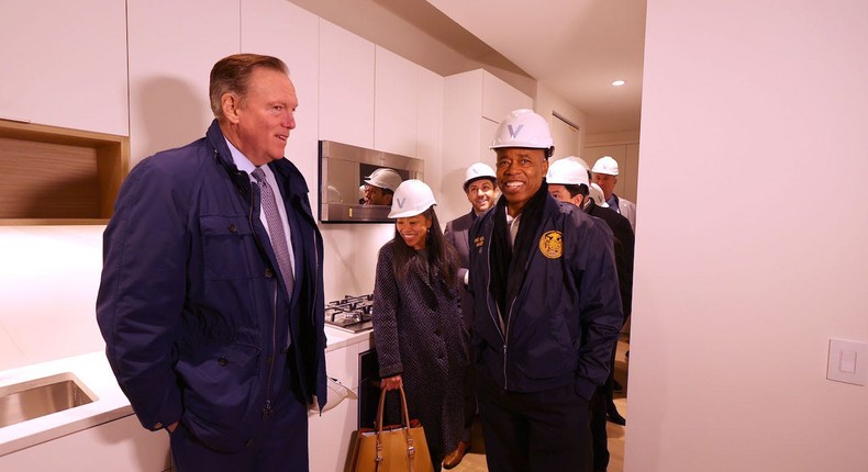 Mayor Eric Adams, right, and Richard Coles, the founder and a managing partner at the Vanbarton Group, tour a new apartment at building located at 160 Water Street in downtown Manhattan in March.Luiz C. Ribeiro/Getty Images