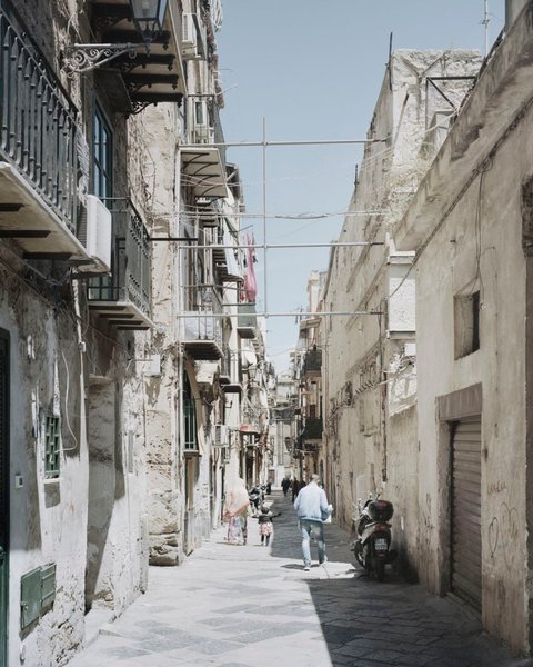 A street in the Ballaro neighborhood in Palermo, Italy. The Ni­ger­ian mafia holds territory in the country from the north in Turin to the south in Palermo. (Valentino Bellini/For The Washington Post)