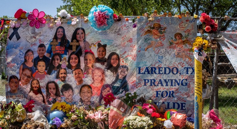 A poster dedicated to the 19 children and two adults who were killed in the mass shooting is seen hung up in front of Robb Elementary School in Uvalde, Texas, on June 17, 2022.Brandon Bell/Getty Images