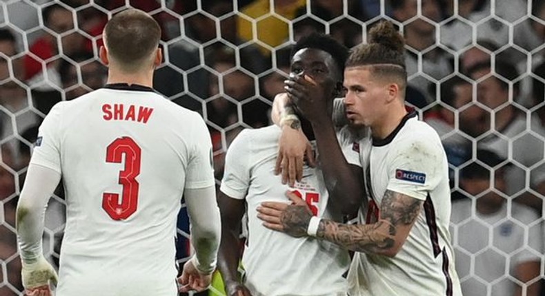 England players console Bukayo Saka after his penalty miss in Euro 2020