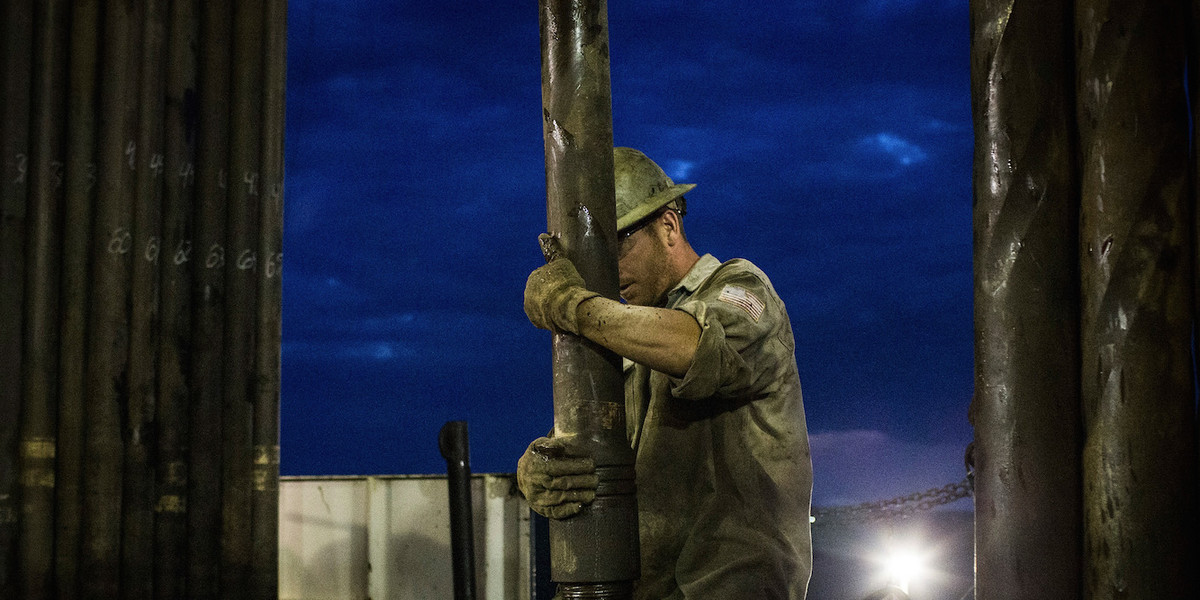 Scott Berreth, a derrick hand for Raven Drilling, working on an oil rig drilling into the Bakken shale formation in 2013 outside Watford City, North Dakota.