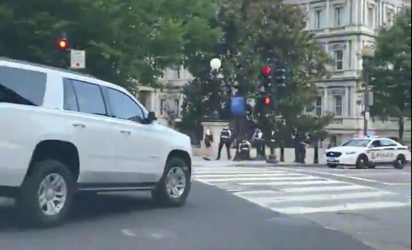 Police officers stop a suspect after a shooting incident outside of the White House, in Washington